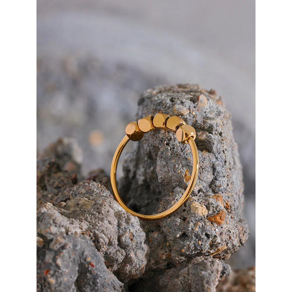 Beaded geometric ring in 18K gold-plated stainless steel.