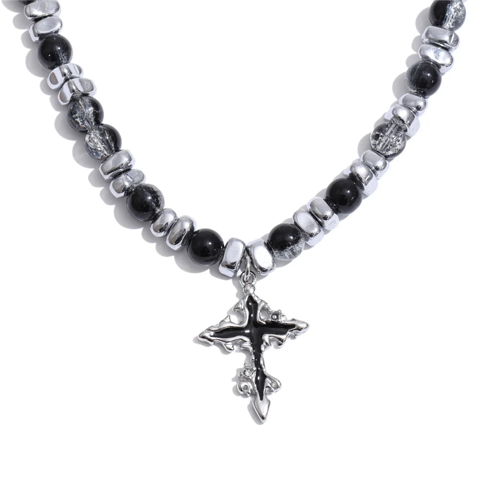 Natural stone cross beaded necklace in gold-plated stainless steel with natural stone.
