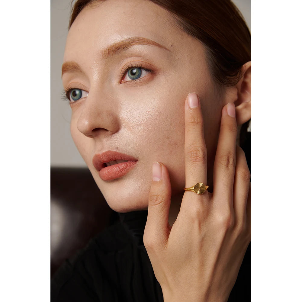 Geometric ring in gold-plated stainless steel.
