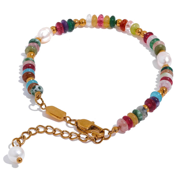 Gold-plated bracelet with pearl and natural stones.