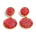 Resin geometric earrings in gold-plated stainless steel with resin.