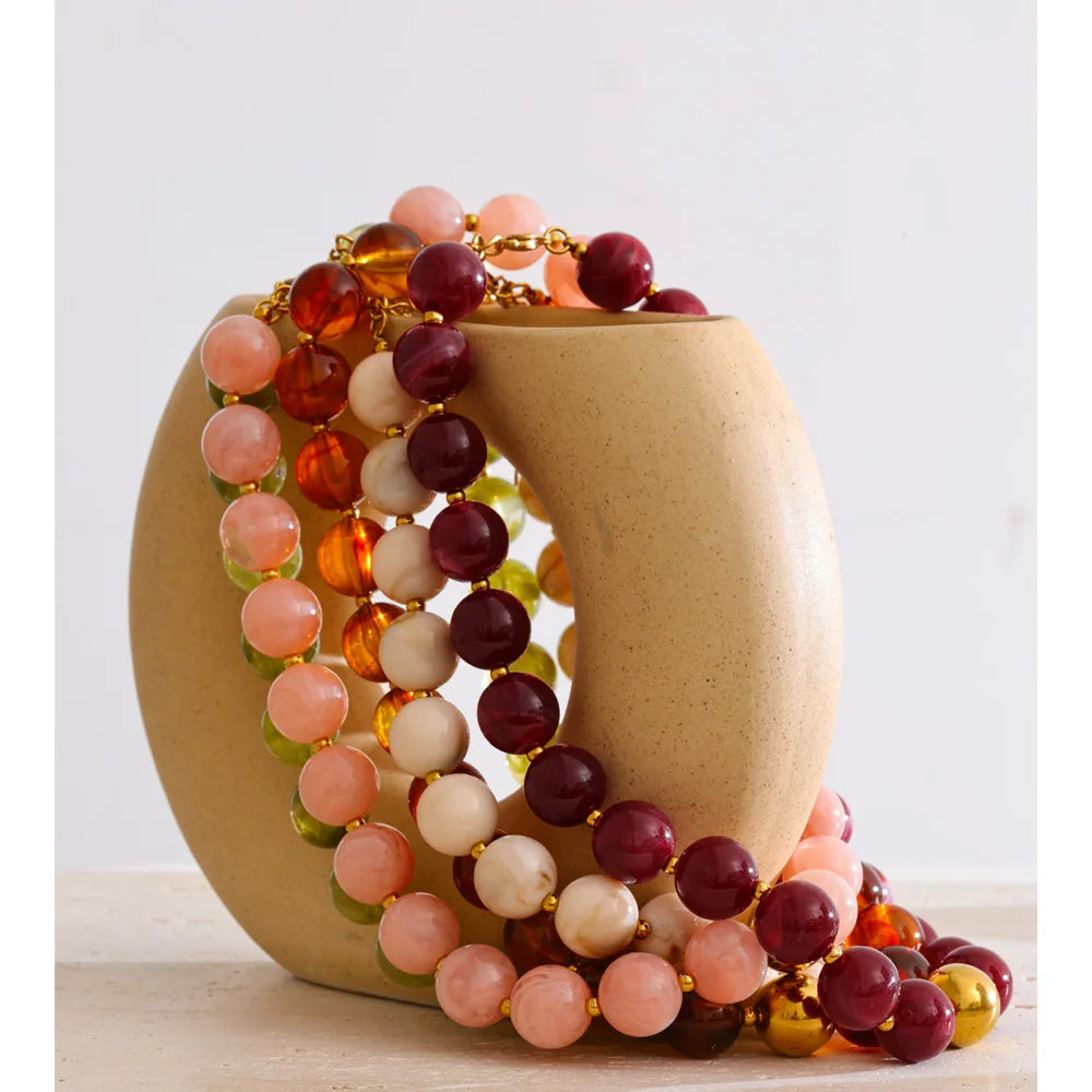 Resin beaded multi-color necklace in gold-plated stainless steel with resin.