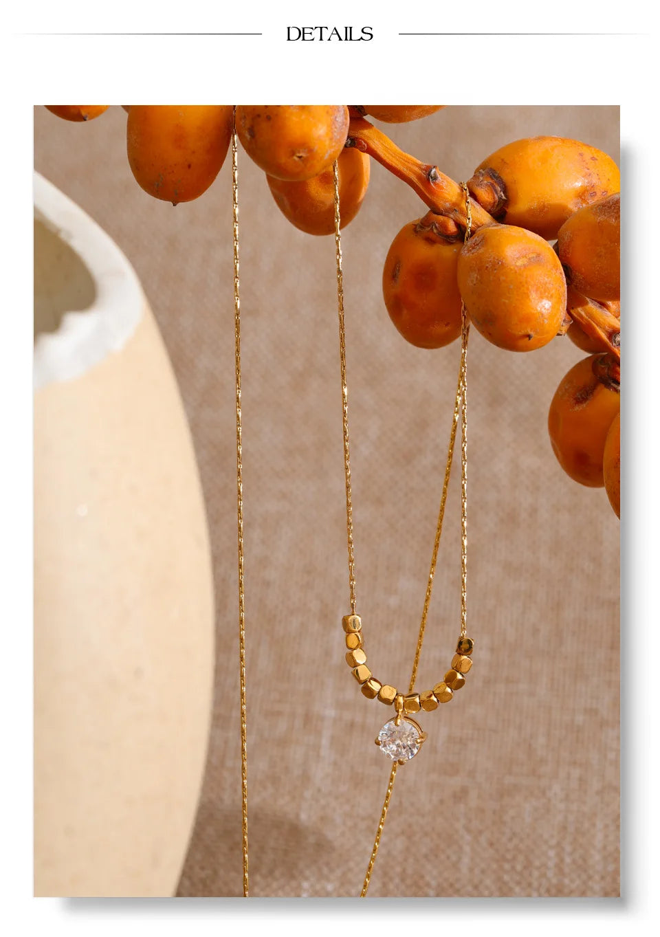 Cubic zirconia beaded geometric necklace in gold-plated stainless steel with cubic zirconia.