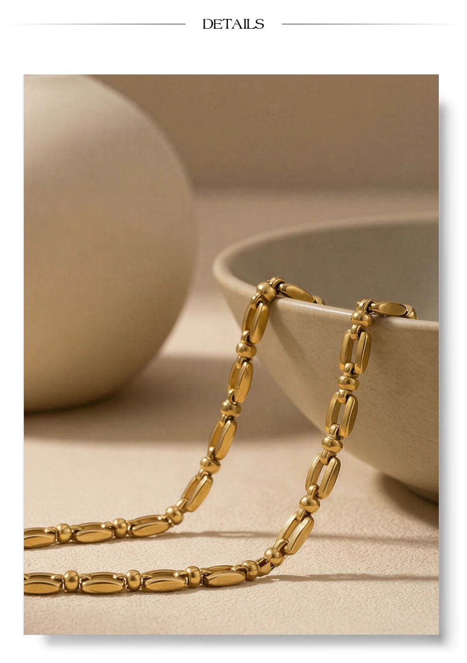 Geometric chain necklace in gold-plated stainless steel.