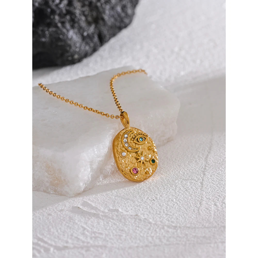 Cubic zirconia star moon necklace in gold-plated stainless steel with cubic zirconia.