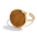 Natural stone geometric ring in 18K gold-plated stainless steel with natural stone.