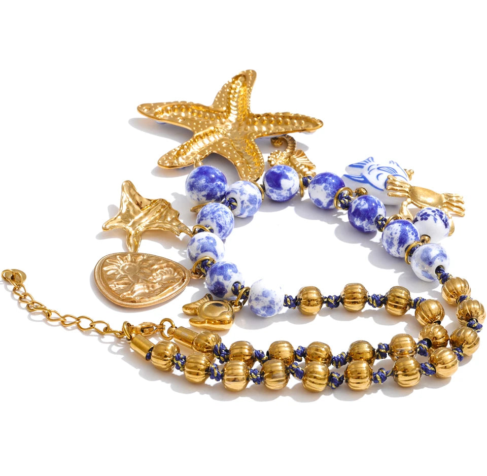 Star beaded geometric necklace in gold-plated stainless steel.