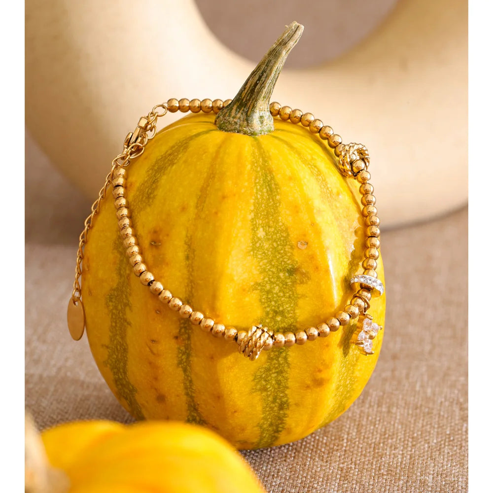 Cubic Zirconia Flower Beaded Bracelet — Gold-Plated Stainless Steel with Cubic Zirconia · PS1066