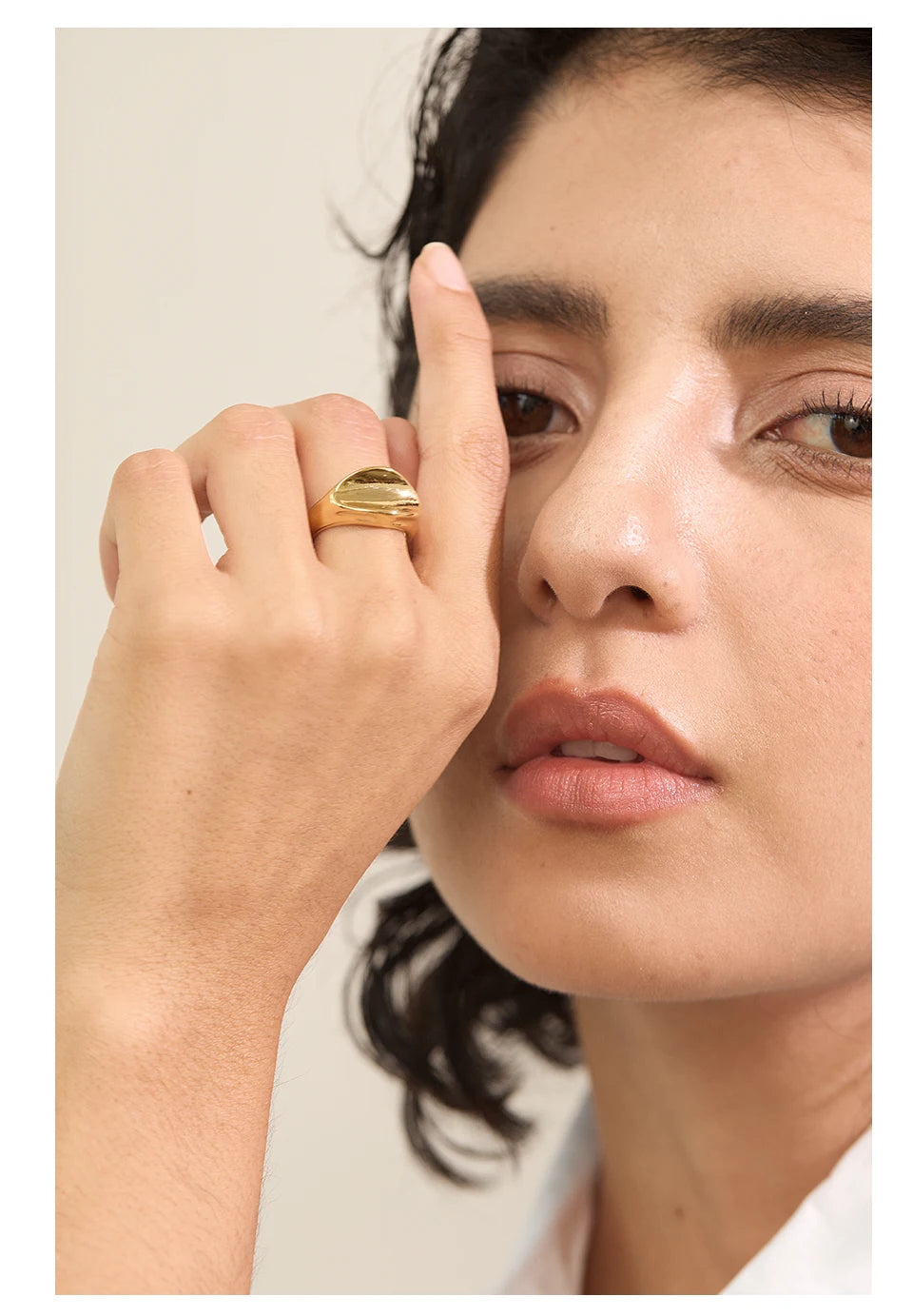 Geometric ring in gold-plated stainless steel.