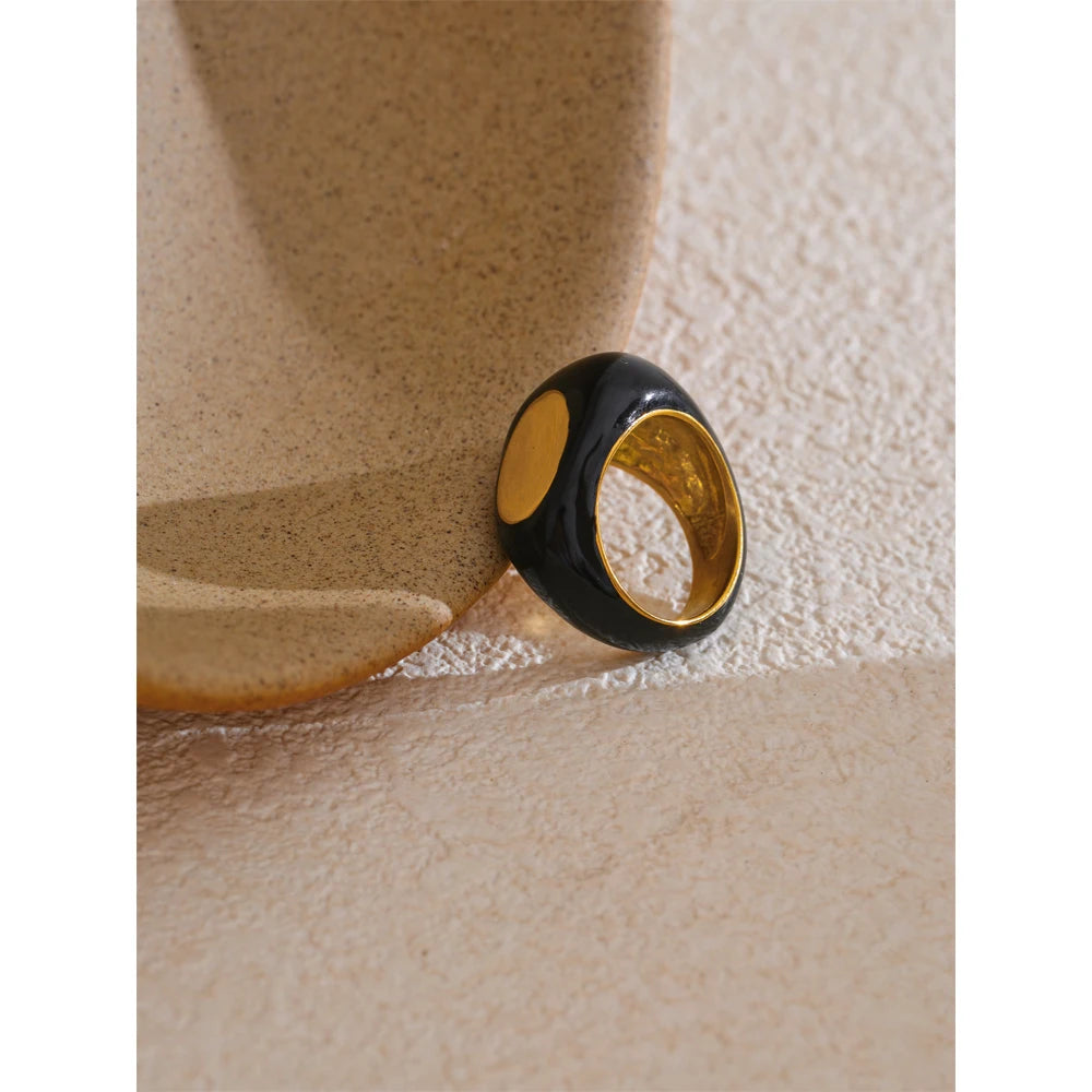 Black enamel geometric ring in gold-plated 316L stainless steel with enamel.