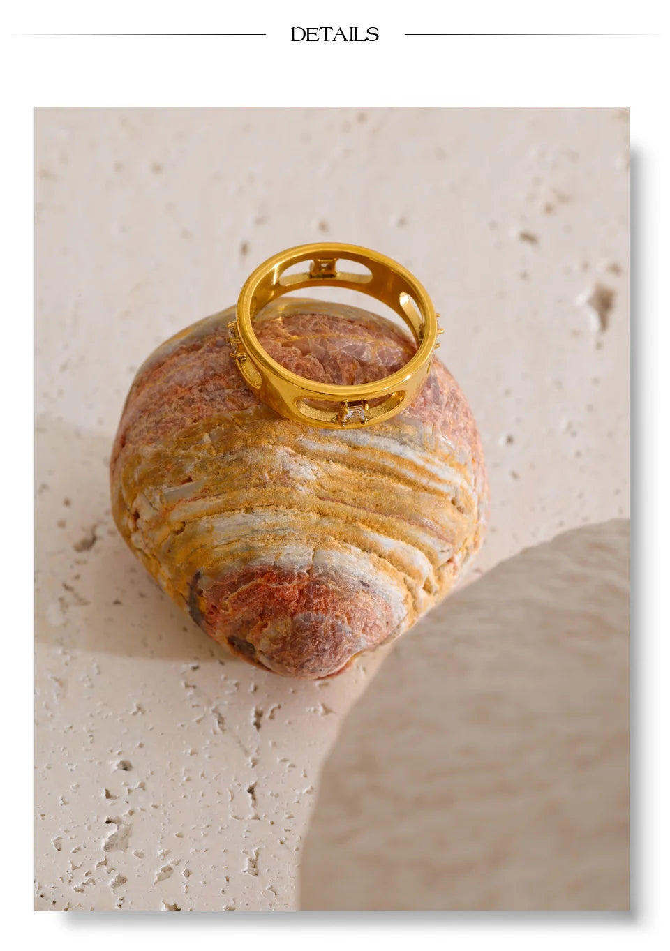 Cubic zirconia geometric ring in 18K gold-plated stainless steel with cubic zirconia.