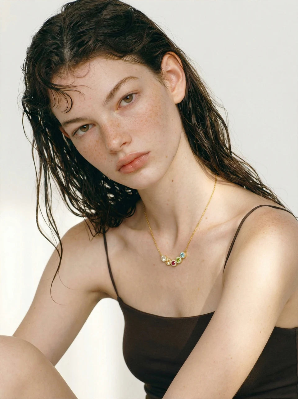 Cubic zirconia multi-color geometric necklace in gold-plated stainless steel with cubic zirconia.