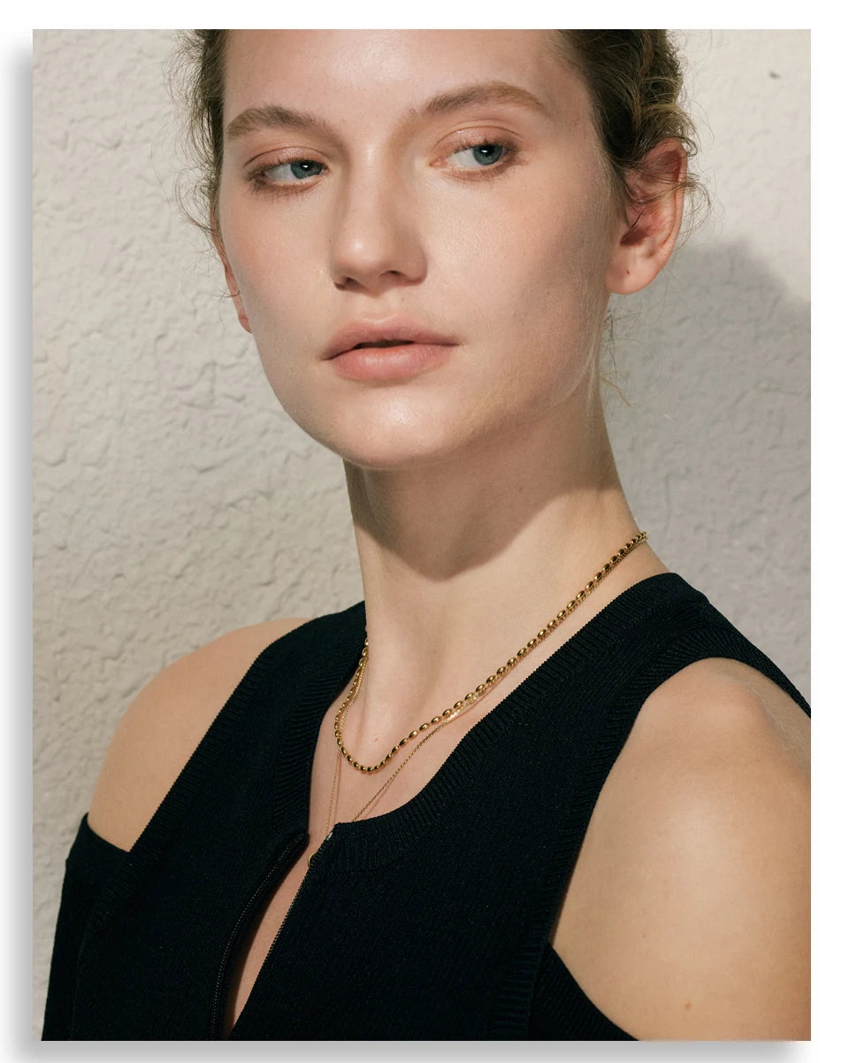 Geometric chain layered necklace in gold-plated stainless steel.