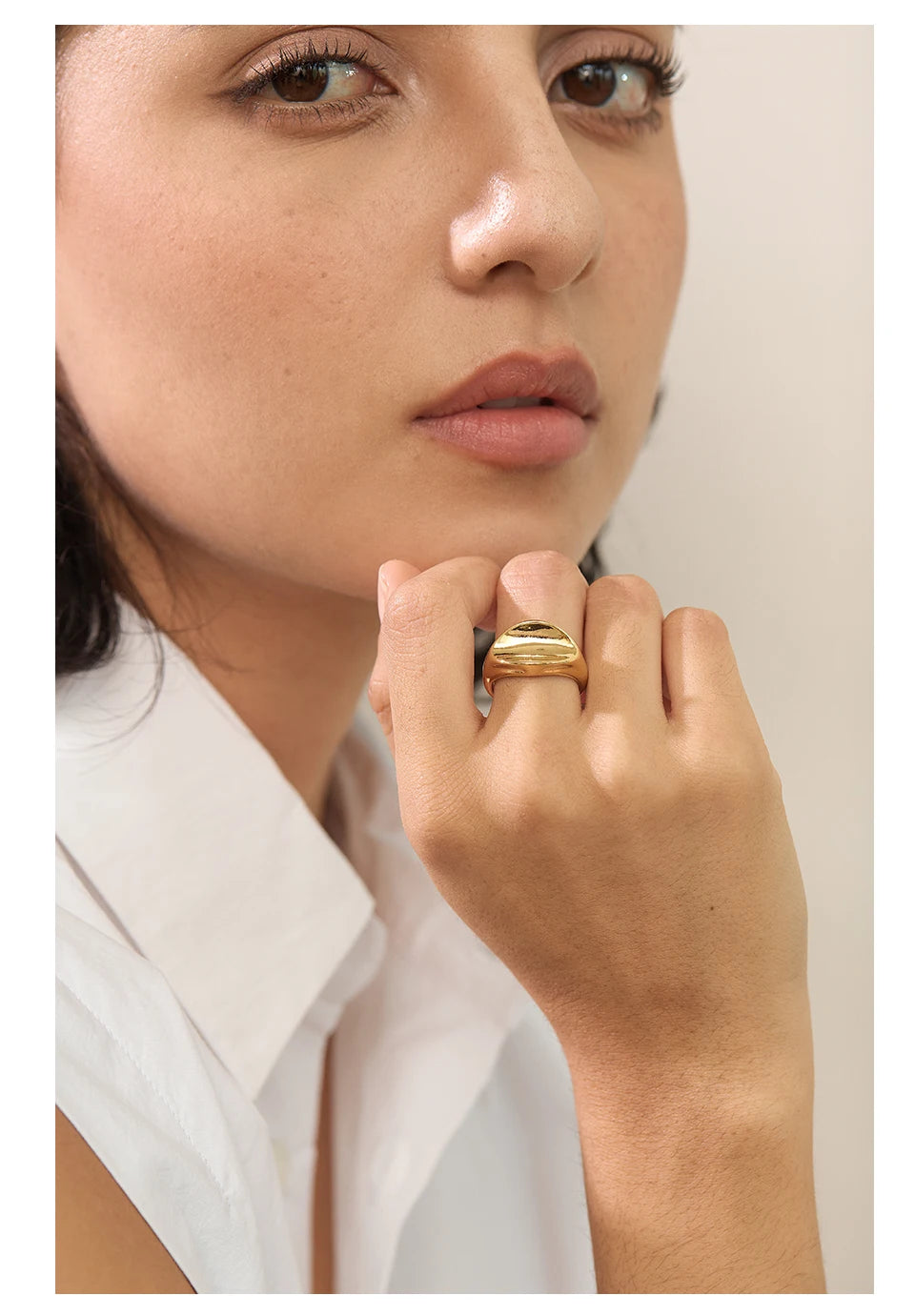 Geometric ring in gold-plated stainless steel.