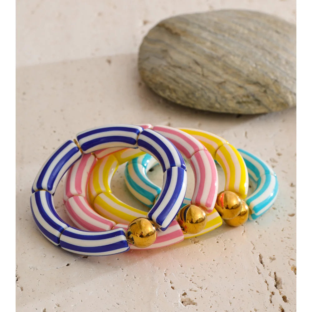 Resin acrylic multi-color bracelet in gold-plated stainless steel with resin and acrylic.