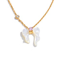 Shell butterfly necklace in gold-plated stainless steel with shell.