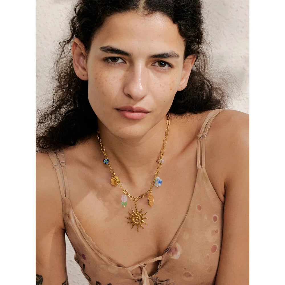 Sun geometric necklace in gold-plated stainless steel.