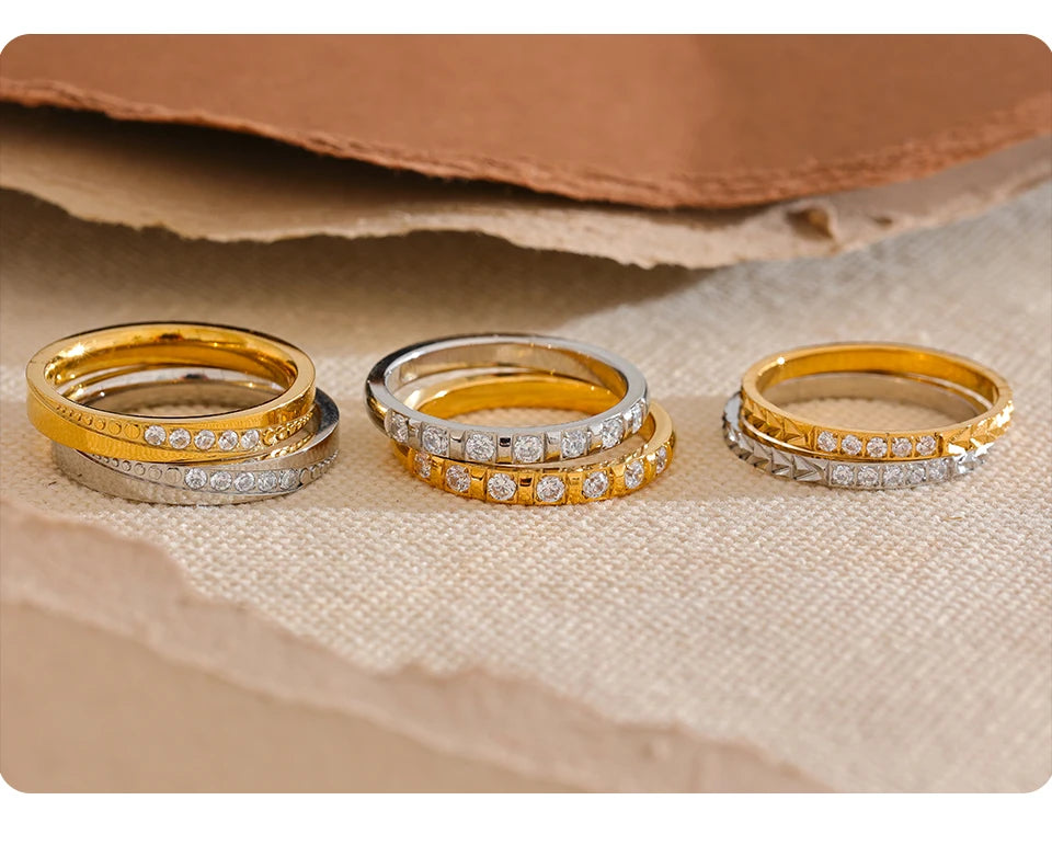 Cubic zirconia geometric ring in 18K gold-plated stainless steel with cubic zirconia.