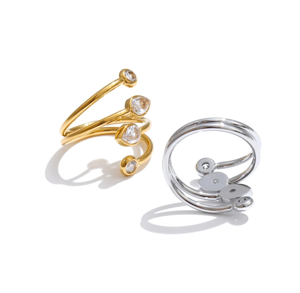 Cubic zirconia geometric layered ring in 18K gold-plated stainless steel with cubic zirconia.