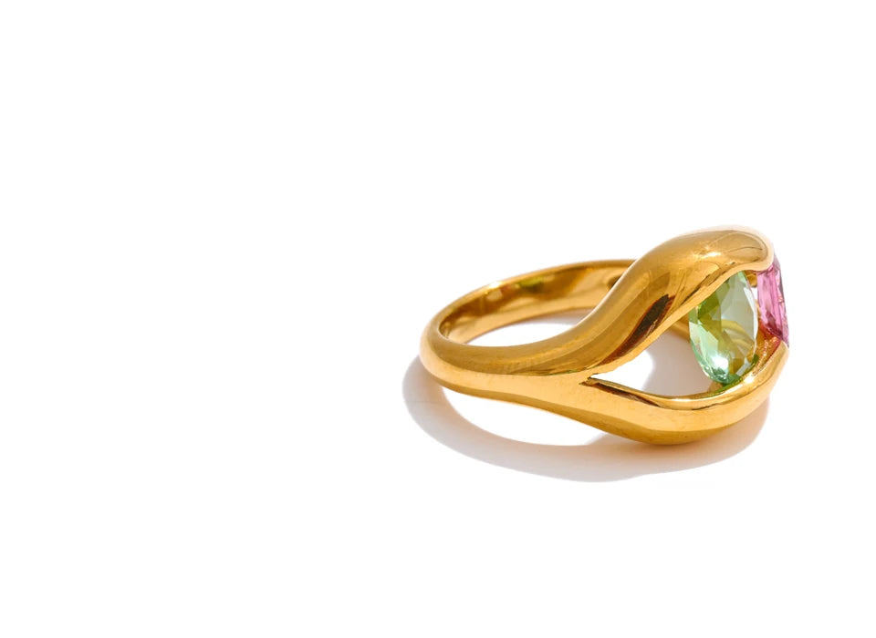 Cubic zirconia geometric ring in 18K gold-plated stainless steel with cubic zirconia.