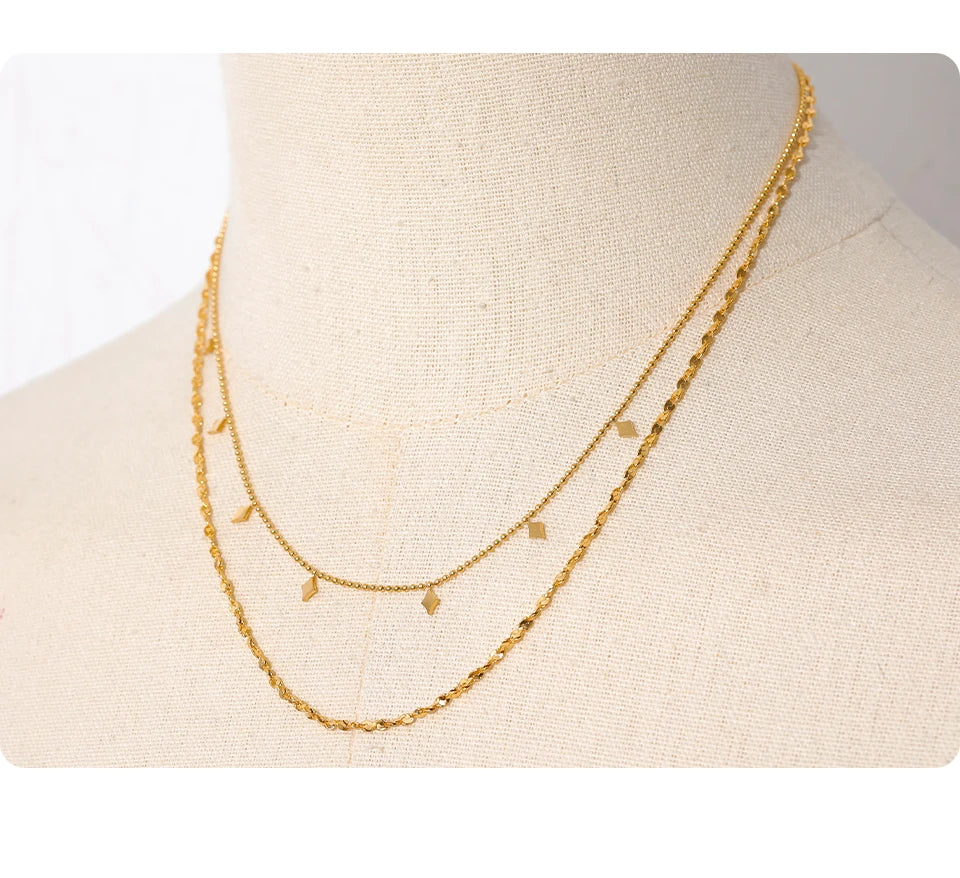 Geometric chain layered necklace in gold-plated stainless steel.