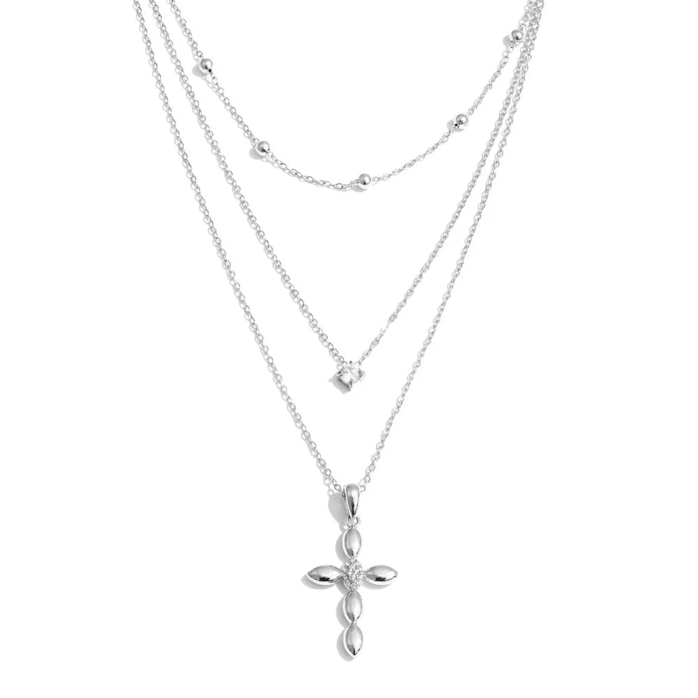 Cubic zirconia cross chain necklace in gold-plated stainless steel with cubic zirconia.