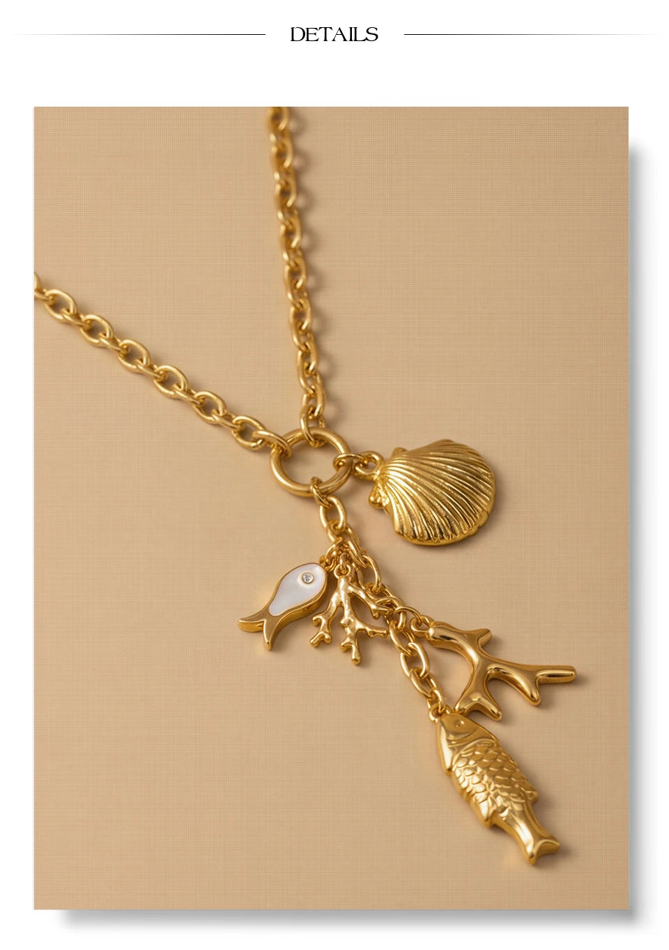 Cubic zirconia shell geometric necklace in gold-plated stainless steel with cubic zirconia and shell.