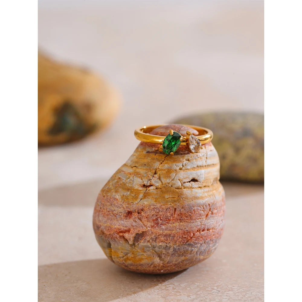 Cubic zirconia geometric ring in 18K gold-plated stainless steel with cubic zirconia.