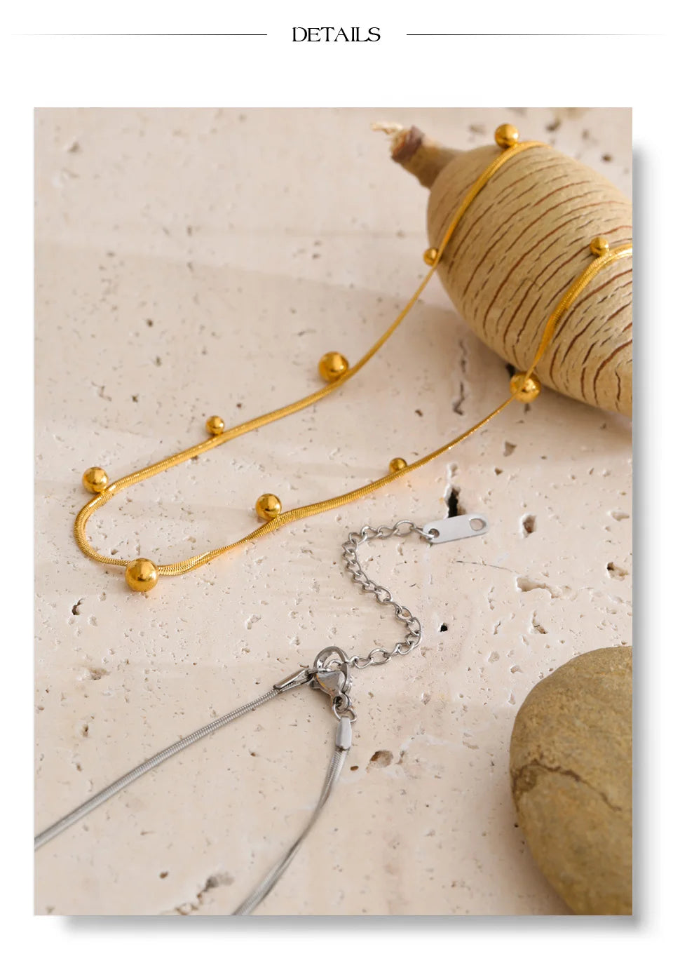 Beaded geometric chain necklace in gold-plated stainless steel.