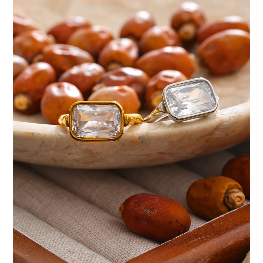 Cubic zirconia geometric ring in 18K gold-plated stainless steel with cubic zirconia.