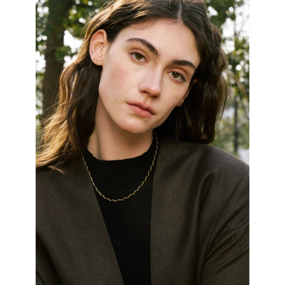Geometric chain necklace in gold-plated stainless steel.