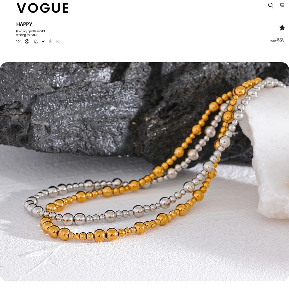 Beaded geometric chain necklace in gold-plated stainless steel.