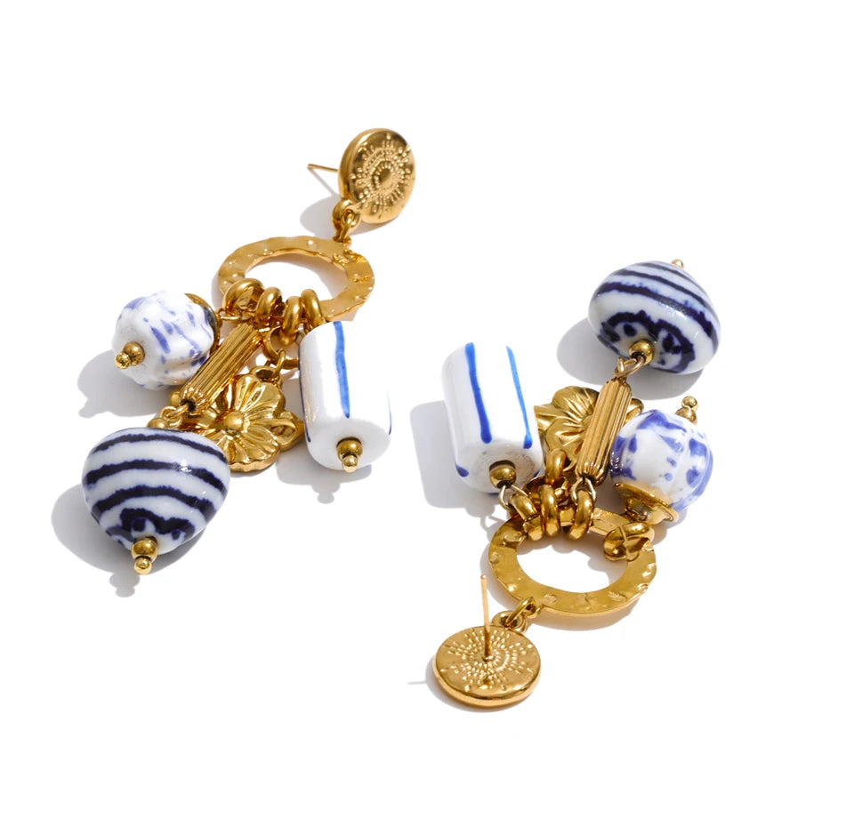 Blue heart flower earrings in gold-plated stainless steel.