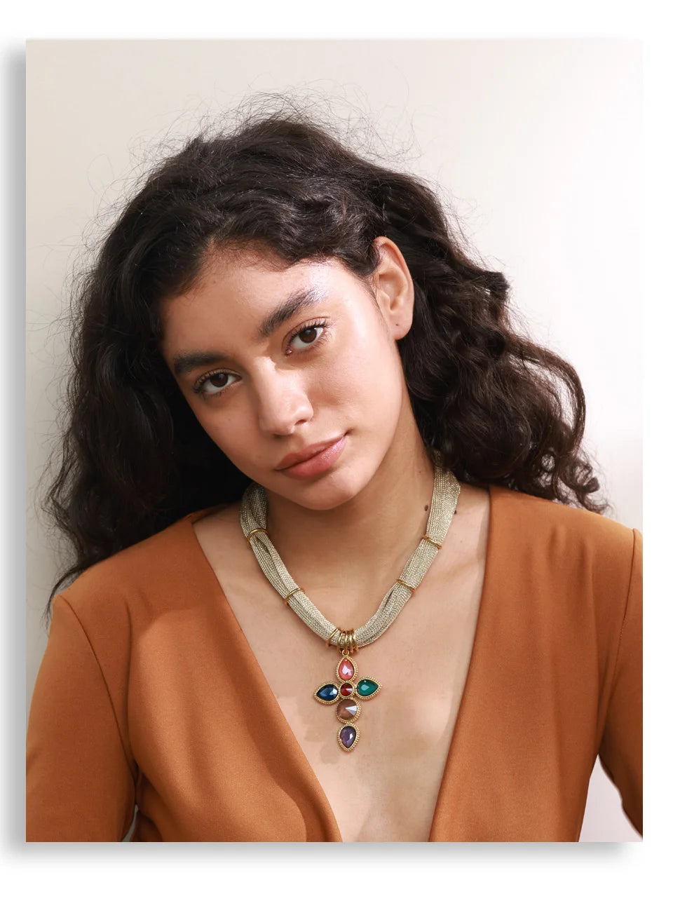 White glass cross necklace in gold-plated stainless steel.
