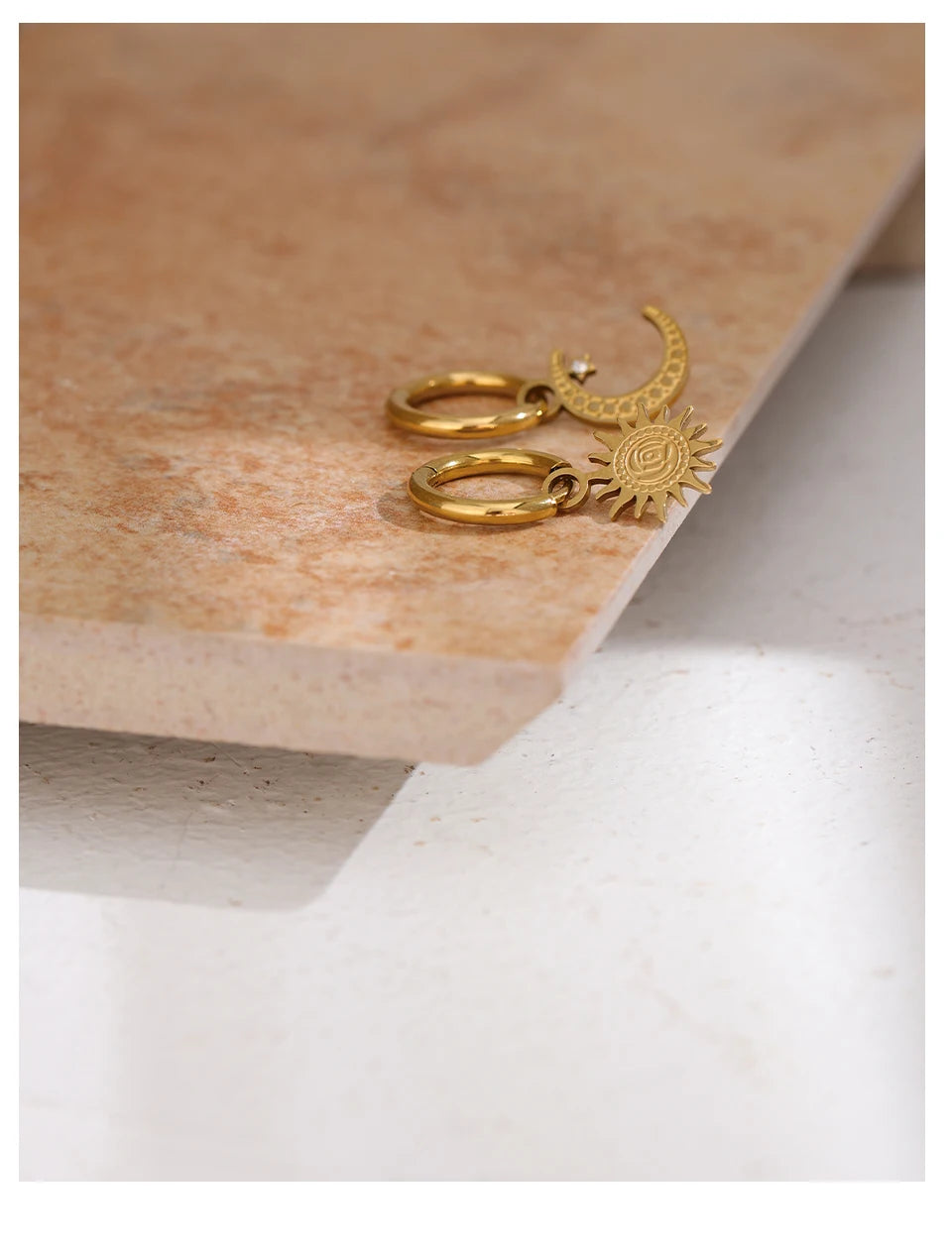 Star moon hammered earrings in gold-plated stainless steel.
