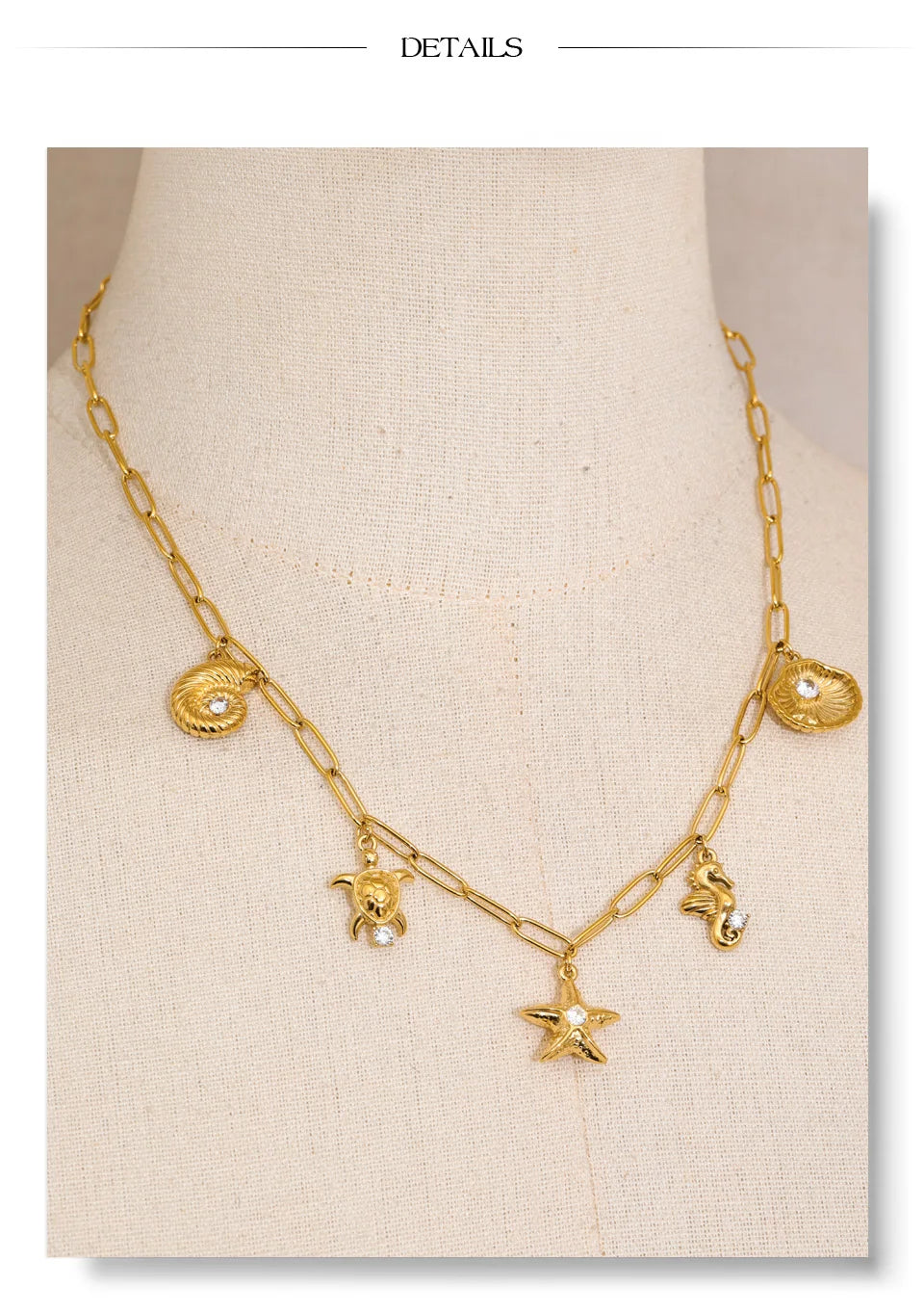 Cubic zirconia shell star necklace in gold-plated stainless steel with cubic zirconia and shell.