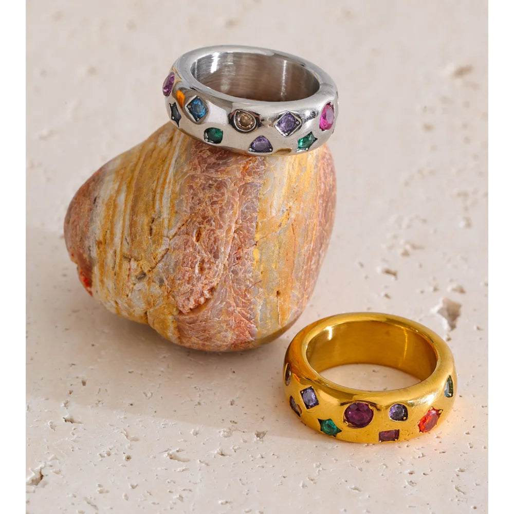 Cubic zirconia multi-color geometric ring in 18K gold-plated stainless steel with cubic zirconia.