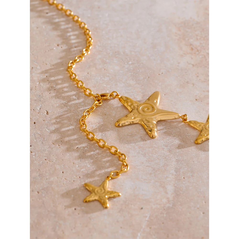 Star chain necklace in gold-plated stainless steel.