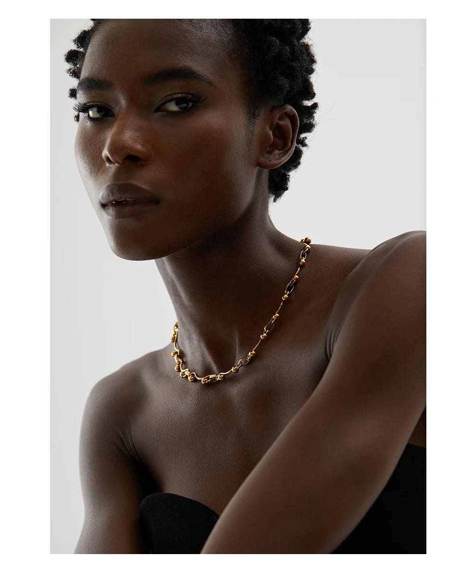 Geometric chain necklace in 18K gold-plated stainless steel.