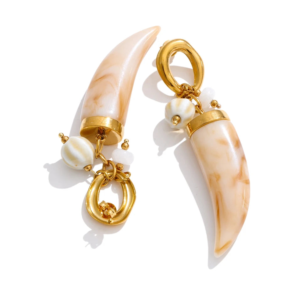 Resin acrylic geometric earrings in gold-plated stainless steel with resin and acrylic.