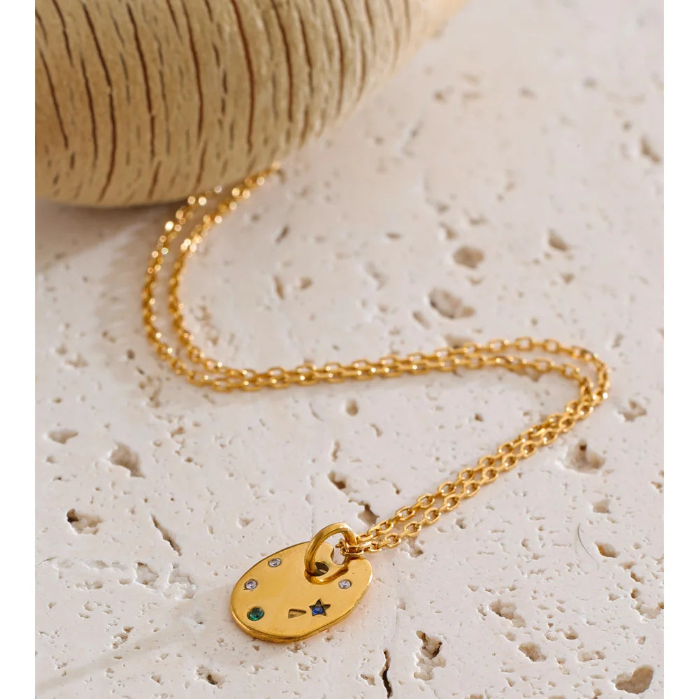 Cubic zirconia multi-color geometric necklace in gold-plated stainless steel with cubic zirconia.