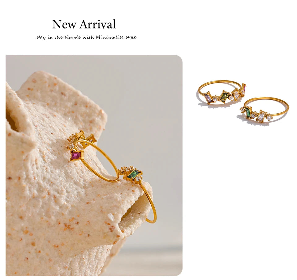 Cubic zirconia multi-color geometric ring in 18K gold-plated stainless steel with cubic zirconia.