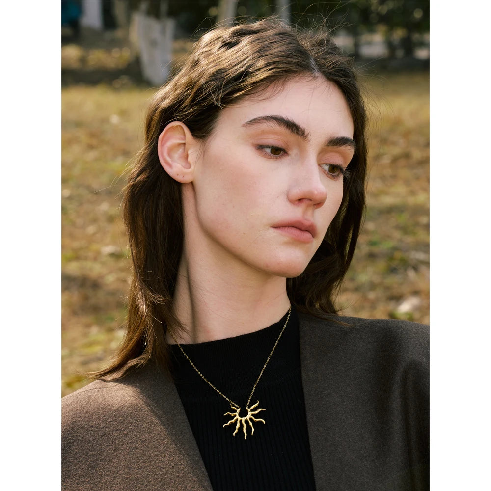 Sun geometric necklace in gold-plated stainless steel.