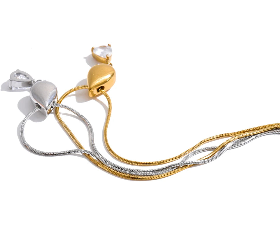 Cubic zirconia geometric necklace in gold-plated stainless steel with cubic zirconia.