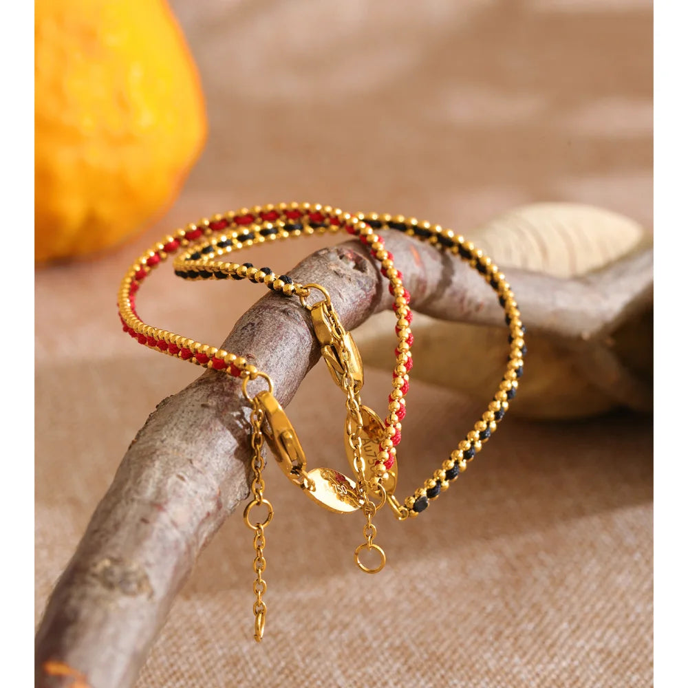 Black geometric chain necklace in gold-plated stainless steel.