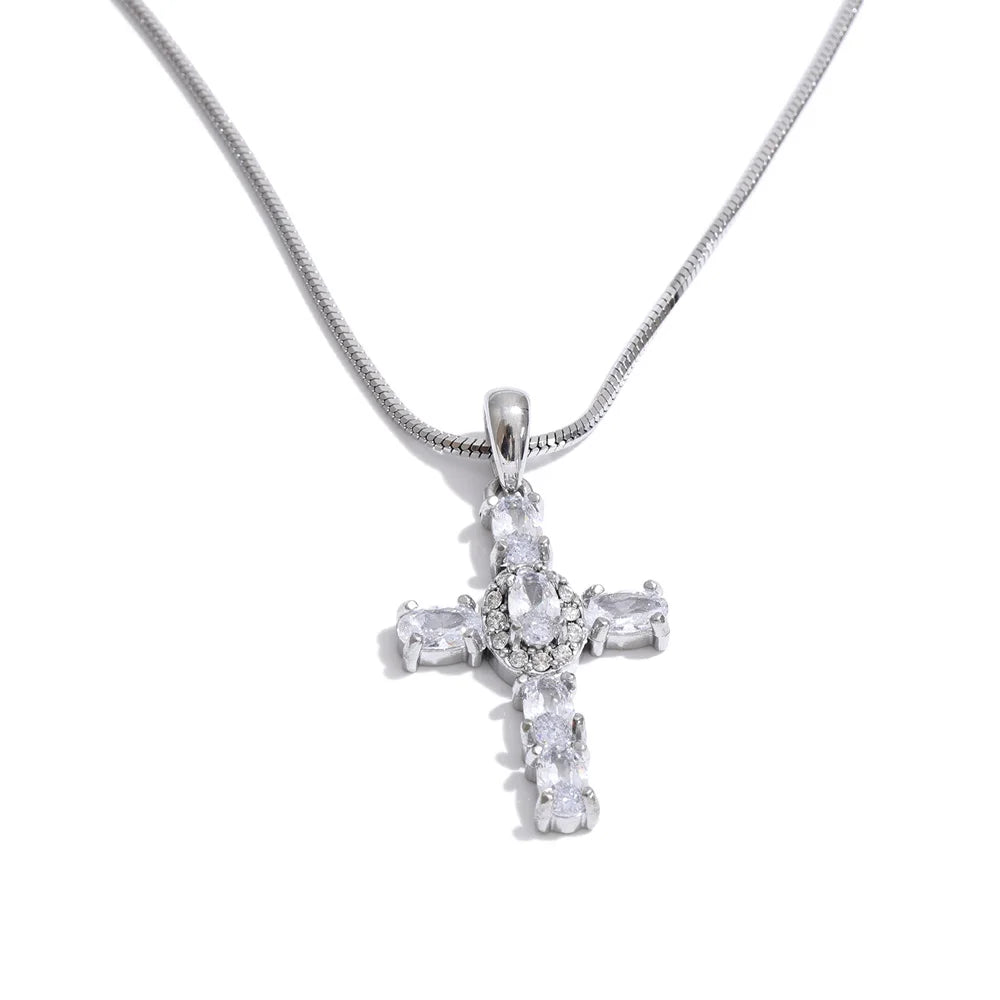 Cubic zirconia cross necklace in gold-plated stainless steel with cubic zirconia.