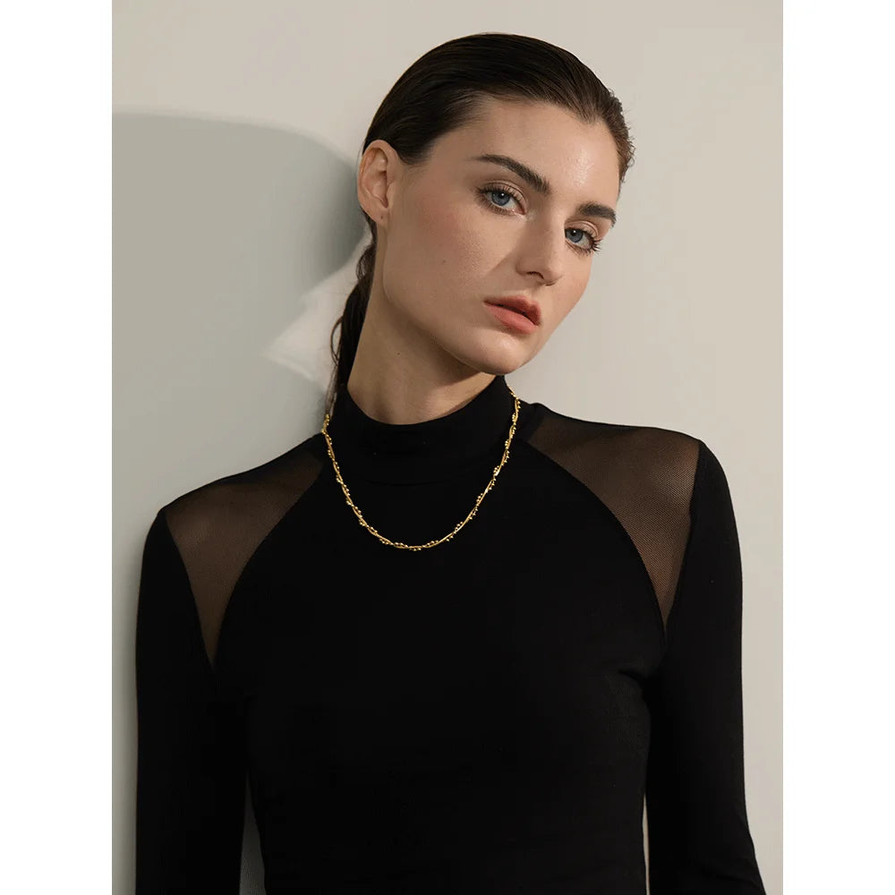 Geometric chain necklace in gold-plated stainless steel.