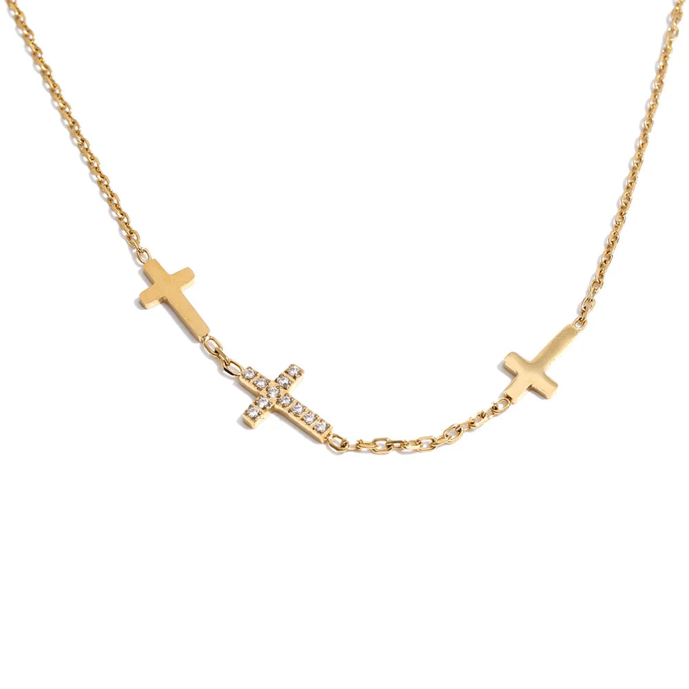 Cubic zirconia cross geometric necklace in gold-plated stainless steel with cubic zirconia.