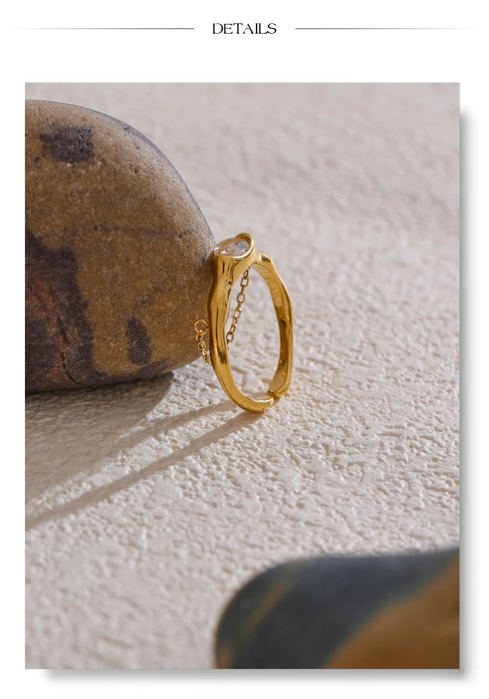 Cubic zirconia geometric chain ring in 18K gold-plated stainless steel with cubic zirconia.