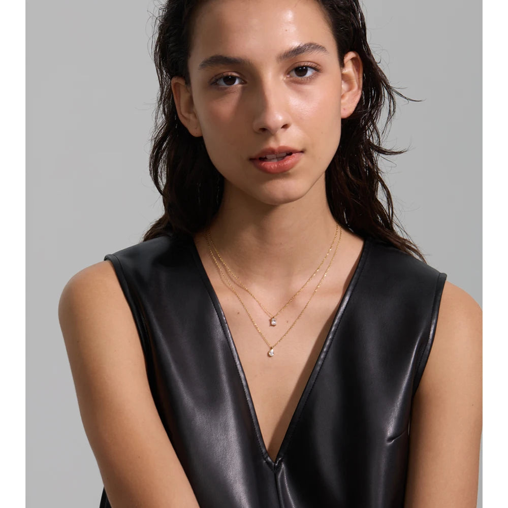 Cubic zirconia geometric layered necklace in gold-plated stainless steel with cubic zirconia.